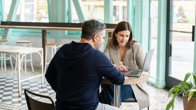 Business owners discussing cold email outreach